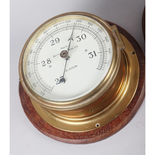 162 - A brass cased bulkhead clock with subsidiary seconds dial and Roman numerals, 7 1/2