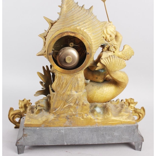 163 - A French gilt mantel clock with white enamel dial, Roman numerals and putto, fish and shell decorati... 