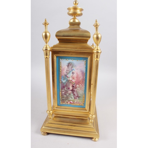 174 - A gilt metal Continental mantel clock with hand-painted porcelain panel, 15 1/4