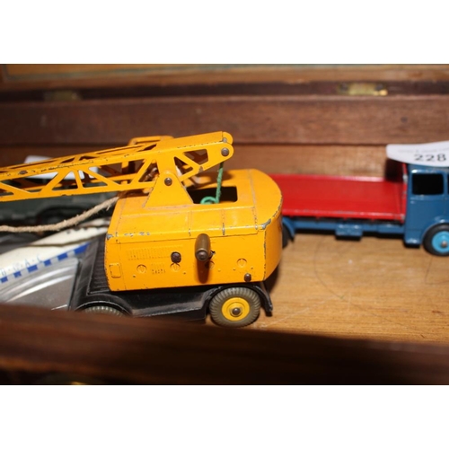 228 - A collection of Dinky Toys diecast models, including a Comet plate, a Dinky Supertoys 