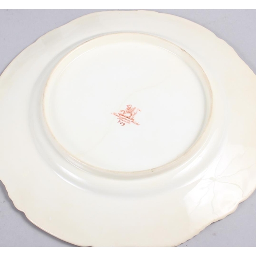 1 - A Rockingham porcelain plate, decorated gilt gadroon border, centre painted pink roses and butterfly... 