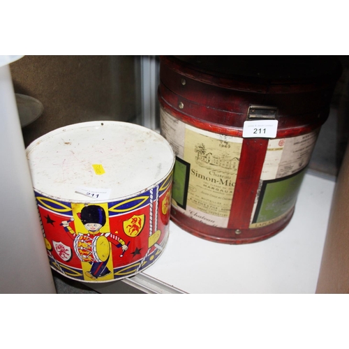 211 - A collection of tins, including Jacobs, money boxes, flour bins and other similar items