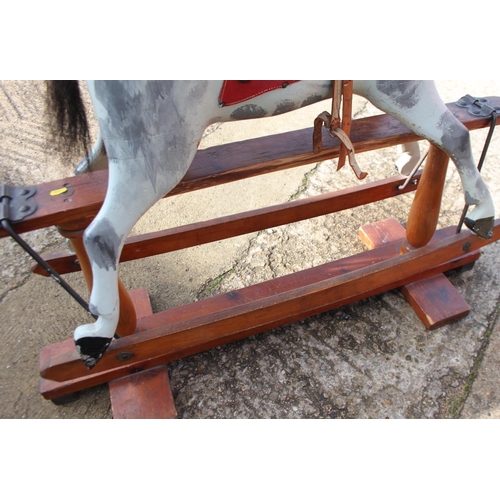 237 - An early 20th century Ayres type carved wood rocking horse, 44