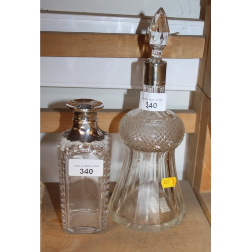 340 - A Victorian cut glass scent bomb with silver top, a cut glass thistle-shape decanter with silver col... 