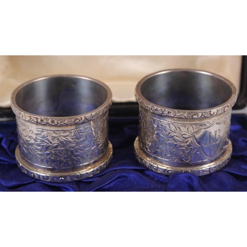 344 - A pair of silver napkin rings with engraved decoration, in box, 2oz troy approx