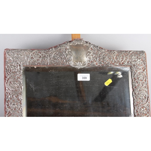 359 - An early 20th century silver scrollwork framed easel dressing mirror, 24