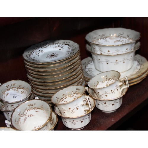 63 - A Rockingham porcelain tea service, decorated weeping gilt foliage, comprising eleven teacups, eleve... 