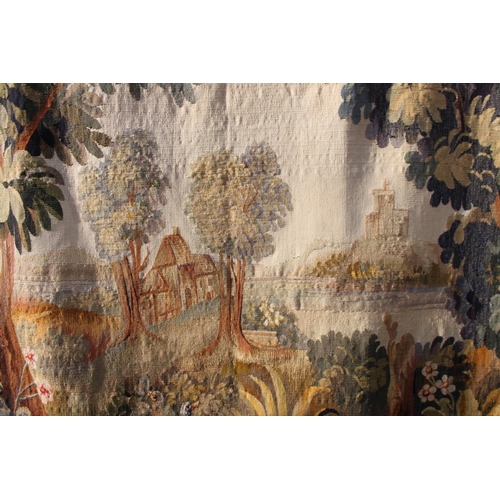 240 - An Aubusson verdure tapestry panel with cottage and castle, 46