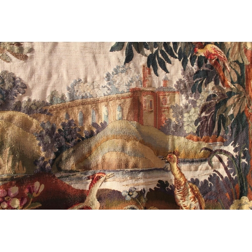 242 - An Aubusson verdure tapestry panel with buildings and viaduct, 48