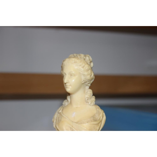 142 - A 19th century carved ivory portrait bust of Marie Antoinette, on turned column, 4 3/4