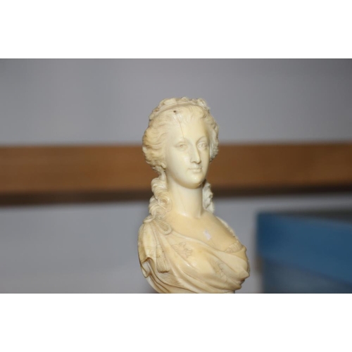 142 - A 19th century carved ivory portrait bust of Marie Antoinette, on turned column, 4 3/4