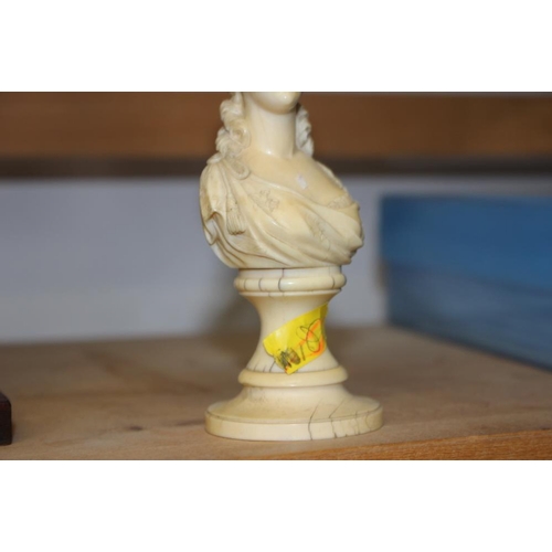 142 - A 19th century carved ivory portrait bust of Marie Antoinette, on turned column, 4 3/4