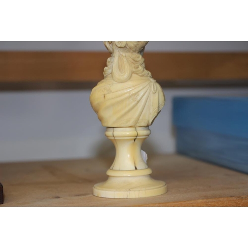 142 - A 19th century carved ivory portrait bust of Marie Antoinette, on turned column, 4 3/4