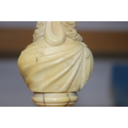 142 - A 19th century carved ivory portrait bust of Marie Antoinette, on turned column, 4 3/4