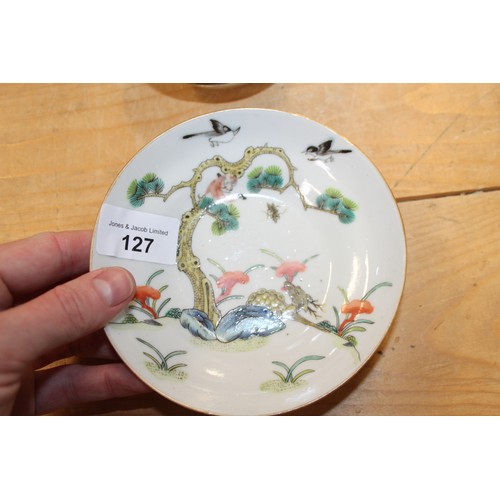 127 - A pair of Chinese polychrome dishes, decorated flowers and insects, 5