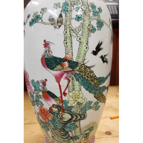 110 - Two Chinese famille vert vases with peacock decoration and figure decoration, 24 1/2