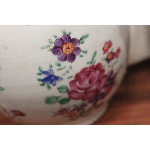 128 - A Chinese export teapot with floral decoration and pink borders, and seven other teapots