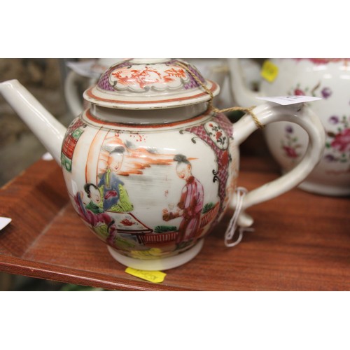 128 - A Chinese export teapot with floral decoration and pink borders, and seven other teapots