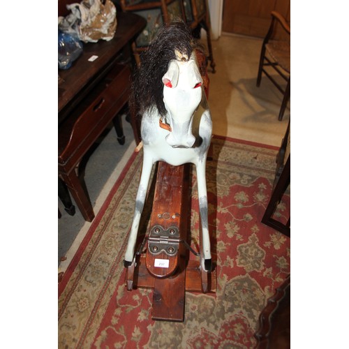 237 - An early 20th century Ayres type carved wood rocking horse, 44