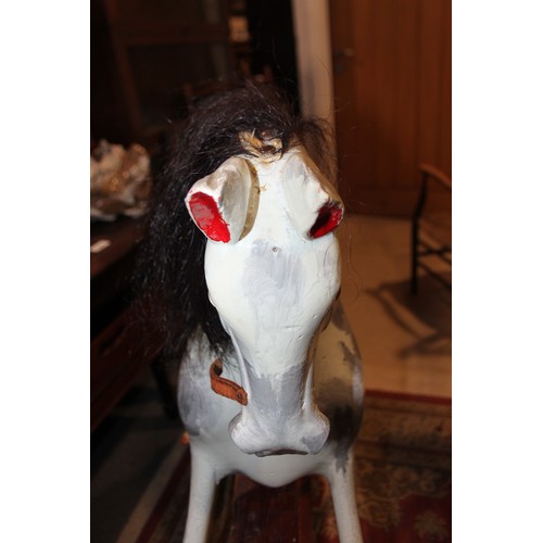 237 - An early 20th century Ayres type carved wood rocking horse, 44