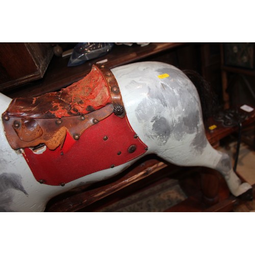 237 - An early 20th century Ayres type carved wood rocking horse, 44