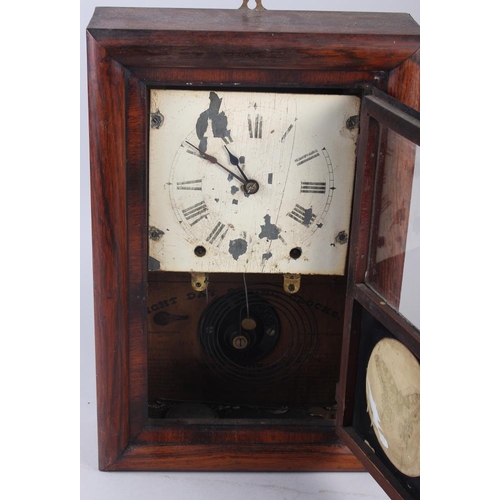 116 - A Seth Thomas rosewood cased drop dial clock with white painted dial and Roman numerals, 16 1/4