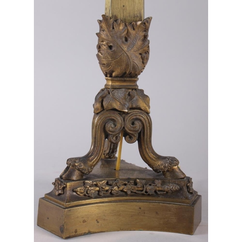 122 - A 19th century brass four light table candelabra with rams heads on triform base (now converted to e... 