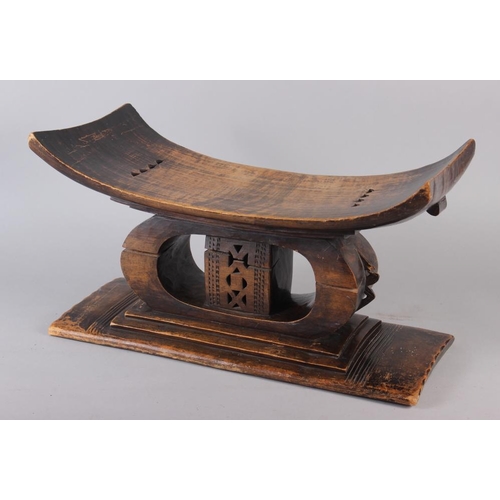 144 - An Ashanti carved hardwood stool, 21