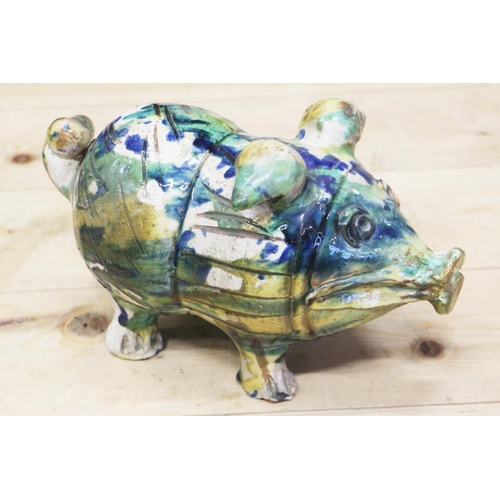 18 - An Italian majolica pig with splashed decoration, 10
