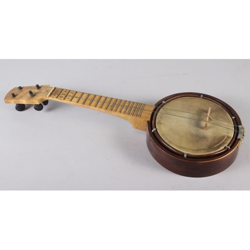 183 - A ukulele banjo, in case