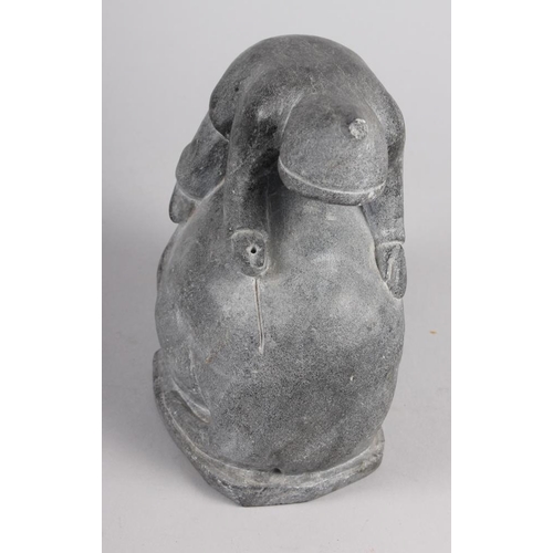 198 - An Inuit hardstone model of a man on a walrus, 8