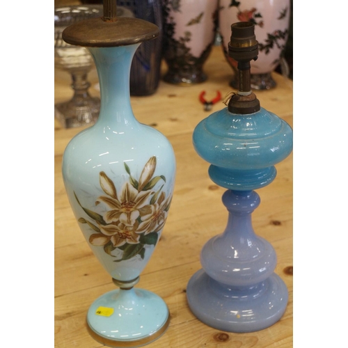 203 - A pair of Victorian transfer decorated glass bottles, now converted to table lamps, 13