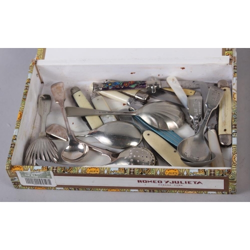 257 - A cased set of six silver teaspoons, another set of teaspoons, a silver plated pair of sugar tongs, ... 