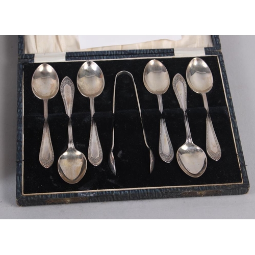 257 - A cased set of six silver teaspoons, another set of teaspoons, a silver plated pair of sugar tongs, ... 