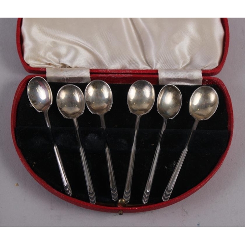 257 - A cased set of six silver teaspoons, another set of teaspoons, a silver plated pair of sugar tongs, ... 