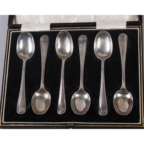 257 - A cased set of six silver teaspoons, another set of teaspoons, a silver plated pair of sugar tongs, ... 