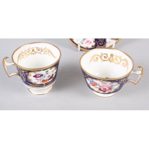 27 - A New China Works,  Worcester bone china floral and gilt decorated trio with Lynn Rose collector's l... 