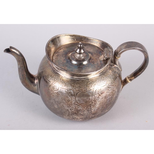 270 - A Victorian silver teapot with engraved decoration, 19.7oz troy approx