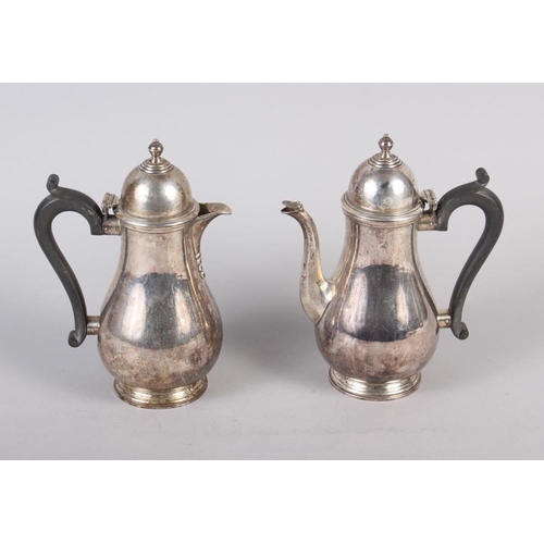 271 - An Elkington & Co silver coffee pot with ebonised handle and a matching hot water pot, 25.3oz troy g... 