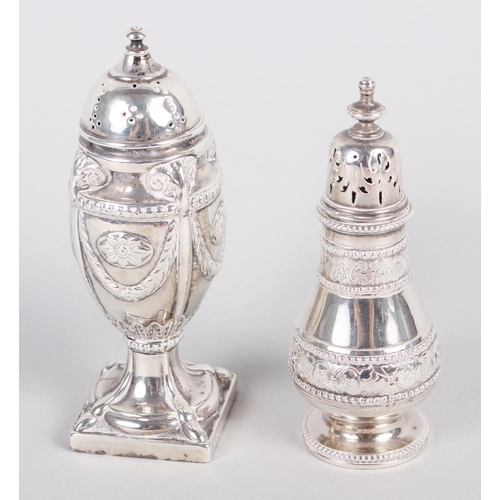 288 - A silver pepper pot with swag decoration, on square base, and another pepper pot with engraved decor... 