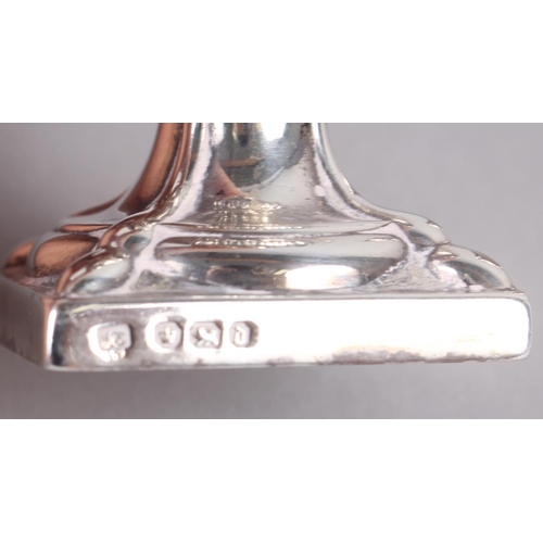 288 - A silver pepper pot with swag decoration, on square base, and another pepper pot with engraved decor... 