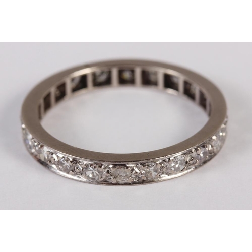 301 - A white metal and diamond set full eternity ring. Size O