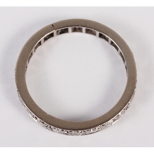 301 - A white metal and diamond set full eternity ring. Size O