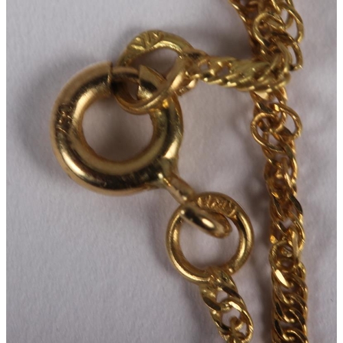 313 - A yellow metal fine link chain, stamped 750, and an Egyptian yellow metal enamel and diamond pendant... 