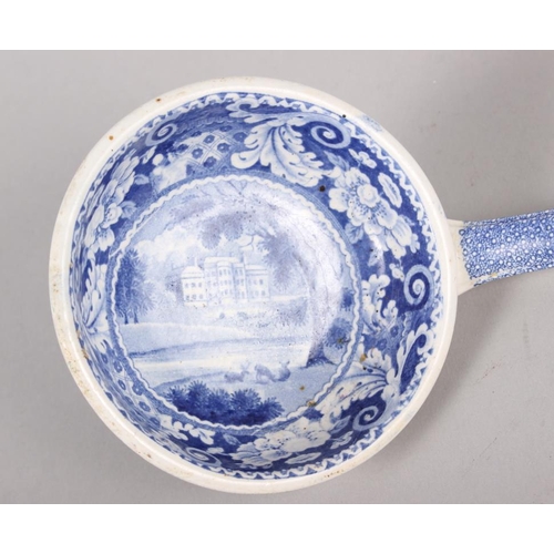 40 - A 19th century blue and white ladle, decorated house in a landscape, 13