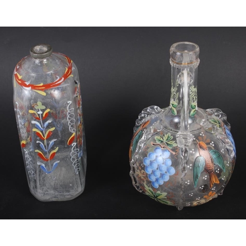 49 - A 19th century glass bottle with carrying handles and enamelled bird and fruit decoration, 6 1/4