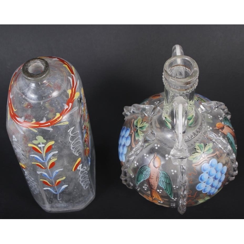 49 - A 19th century glass bottle with carrying handles and enamelled bird and fruit decoration, 6 1/4