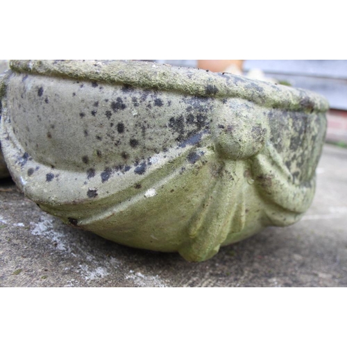 630 - A cast stone planter with swag decoration and another similar planter