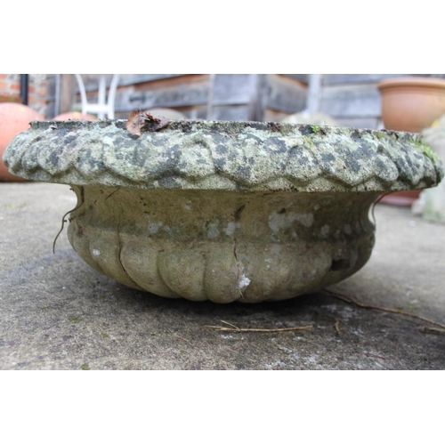 630 - A cast stone planter with swag decoration and another similar planter