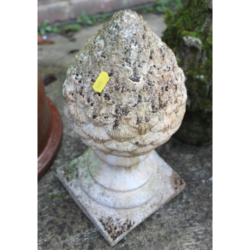 632 - A cast stone garden ornament, in the form of a pinecone, 13